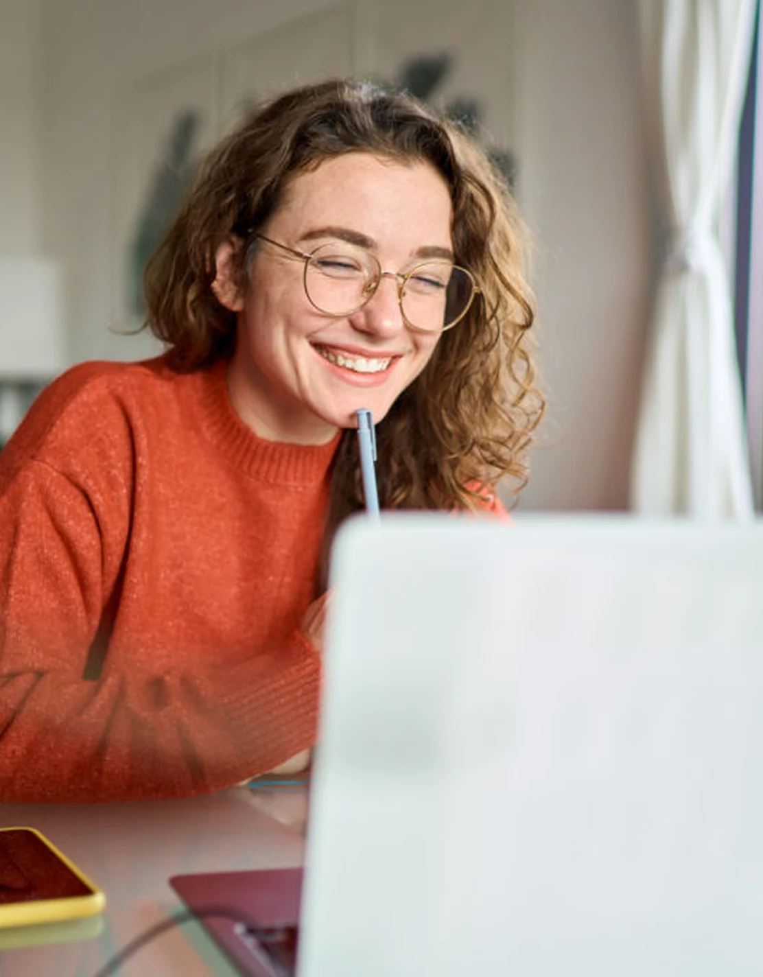 AI Labor Worker smiling at laptop